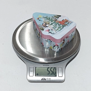 Detailed view of creative cartoon Christmas tin candy box weighing 55.0g for holiday gifts