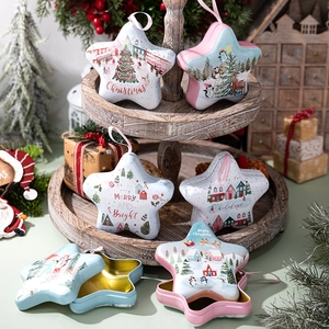 Star-shaped Christmas tin box with hanging ribbon and festive holiday illustrations