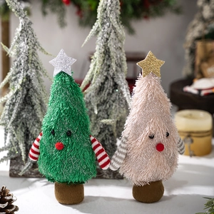 Detail of plush Christmas tree figurines with sequins stars and striped limbs on base