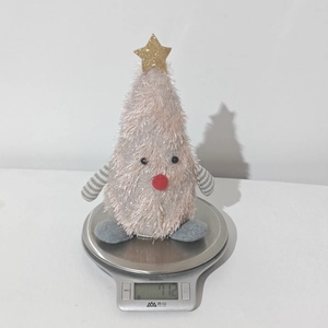 Pink plush Christmas tree toy weighing 71.2g on a scale, showing product weight details