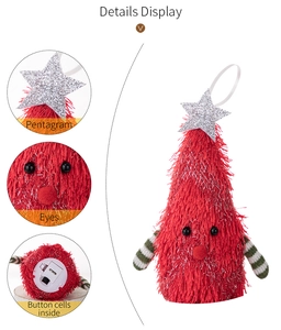 Close-up of glowing plush Christmas gnome with star topper and battery compartment