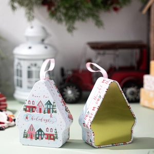 House-shaped Christmas tin gift box with Nordic winter scenes and pink ribbon handle