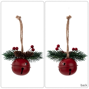 Detail of red Christmas bell ornament with star cutouts, pine needles and pinecone