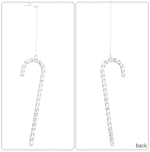 Macro detail of silver twisted Christmas candy cane ornament with hanging silver cord
