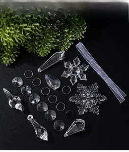 Detailed set of clear acrylic Christmas snowflake and icicle ornaments with white ribbon