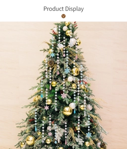 Close-up of clear acrylic snowflake and icicle ornaments on a Christmas tree branch
