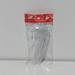 Close-up of transparent acrylic candy cane Christmas tree ornaments in festive packaging