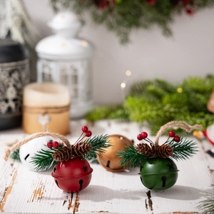 Christmas metal bell ornaments with pine needles berries and pinecones for tree decoration