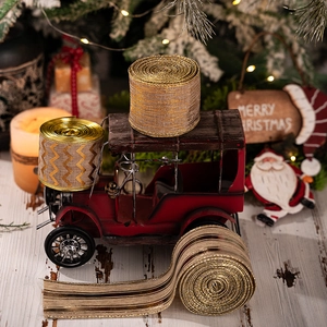 Close-up of metallic gold and brown Christmas linen ribbons for festive wreath decoration