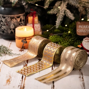 Close-up of champagne gold Christmas ribbons with glittery texture and wire edges
