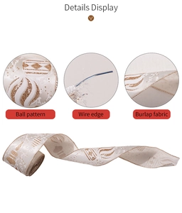 Detail of cream burlap Christmas ribbon featuring golden ball patterns and wired edges
