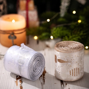Close-up of sparkling Christmas ribbons with glitter snowflakes on a festive table