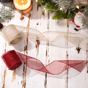 Christmas tree ribbon rolls in gold and red mesh for festive gift wrapping and DIY decor