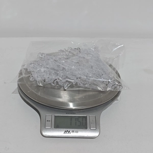 Weight display of 14pcs acrylic Christmas ornaments showing 115.0g on a digital scale
