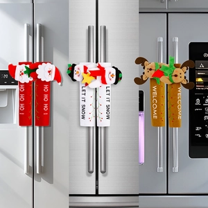 Detailed view of three festive Christmas refrigerator handle covers with 3D cartoon characters