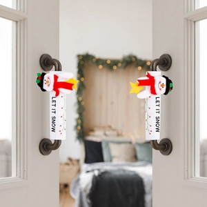 Detail of Christmas snowman handle cover with Let It Snow text on a metal door handle