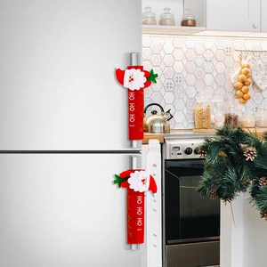 Detail of Christmas Santa appliance handle covers with festive HO HO HO print for refrigerators