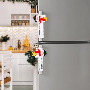 Detailed view of snowman refrigerator handle covers with Let It Snow embroidery