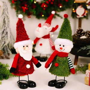Close-up of Santa, snowman and reindeer plush dolls with metal legs for Christmas decor