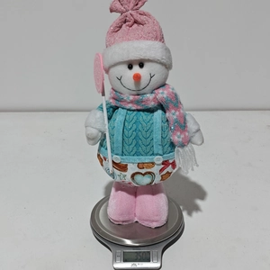 Pink snowman plush toy wearing a blue knit sweater and scarf weighing 350 grams