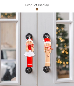 Macro detail of Christmas gingerbread man door handle covers with festive scarf decorations