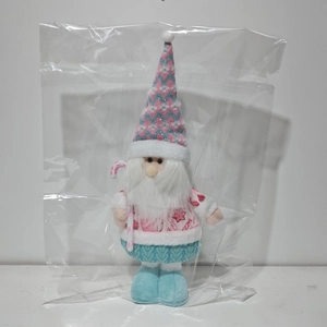 Pink and blue Christmas gnome plush with knitted hat and candy cane in polybag