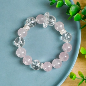 Pink rose quartz and clear white crystal beaded bracelet with sparkling silver spacers