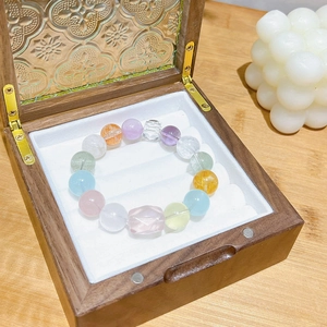 Colorful 12mm macaron crystal bead bracelet with faceted clear stone on wood box