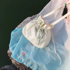 Handmade Hanfu drawstring bag with bamboo and deer embroidery and black tassel detail