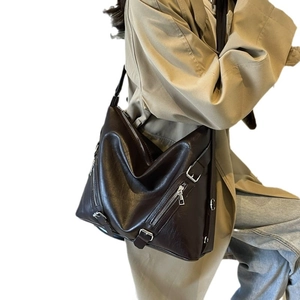 Deep brown oversized PU leather tote bag with silver zippers and adjustable buckles