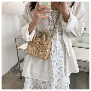 Mini floral lace crossbody bag with pink and green embroidery and khaki leather strap