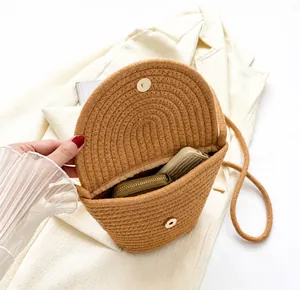 Top view of woven straw bag interior showing capacity for phone and wallet details