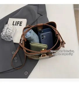 Top view showing large capacity of woven bucket bag with phone and umbrella