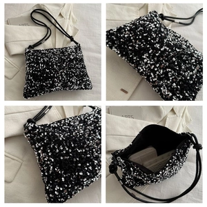Detailed views of sequined bucket bag with black and silver sparkles and interior storage