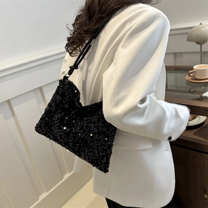 Fashionable black sequin bucket bag for women with elegant shoulder strap for evening wear