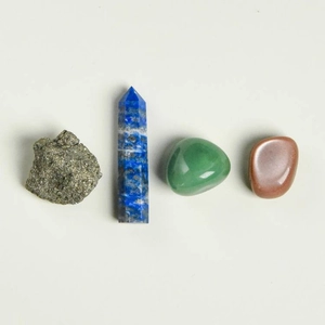 Healing natural crystal set with quartz pillar, tumbled stones, and raw chakra minerals