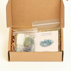 Natural chakra crystal set with raw stones and healing property card in a gift box