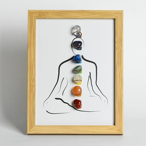 Chakra crystals yoga meditation art frame with polished natural gemstones in light wood