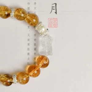 Bracciale artigianale con perle di cristallo giallo 11mm, pendente di cristallo bianco e argento