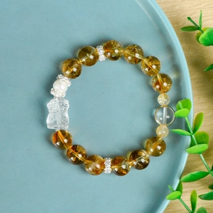 Bracciale in cristallo giallo 11mm con cristallo bianco e distanziatori floreali in argento
