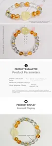 Vue détaillée des perles de cristal blanc 10mm avec pendentif renard en citrine sculptée