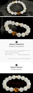 Macro detail of 10.5mm white phantom crystal beads and citrine on volcanic rock