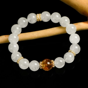 White phantom crystal and yellow citrine 10mm beaded bracelet on black reflective background