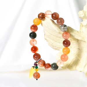 Natural 10mm multi-gemstone beaded bracelet with yellow feather charm on creative stand