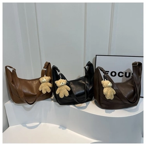 Three moon-shaped hobo bags in brown, black, and coffee PU leather with bear charms