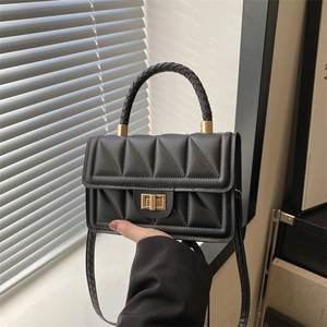 Classic black quilted crossbody bag with woven handle and gold clasp for women