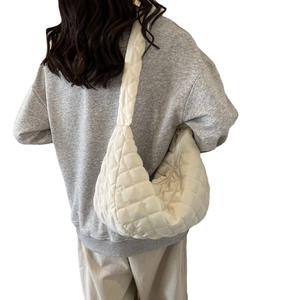 White quilted nylon crescent shoulder bag with elegant rhombus pattern for daily wear