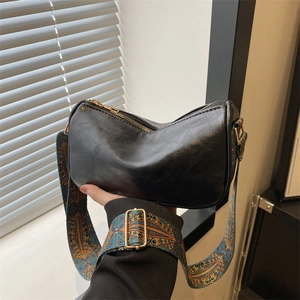 Schwarze Vintage-Leder-Schultertasche mit farbenfroh gewebtem Schultergurt für Damen