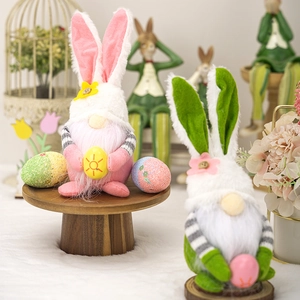 Close-up of Easter gnome plush with plaid ears and flower egg for home decoration