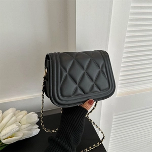 Classic black quilted crossbody bag with gold-tone chain strap and minimalist design